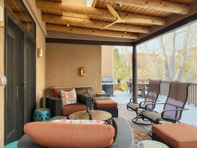 view of patio featuring ceiling fan and a grill