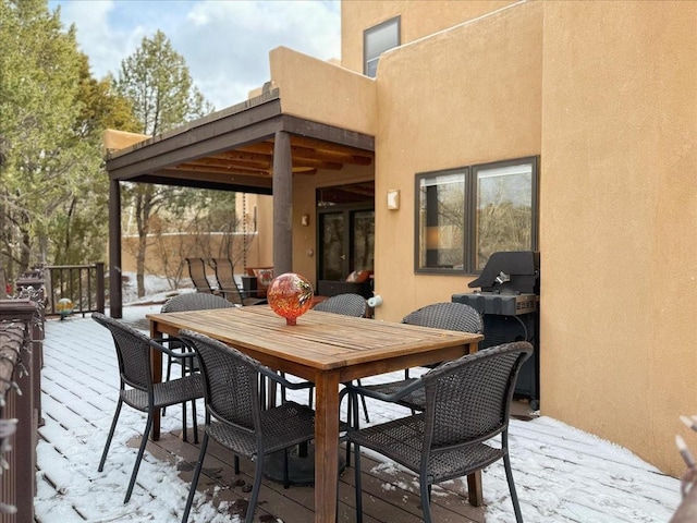 view of snow covered deck