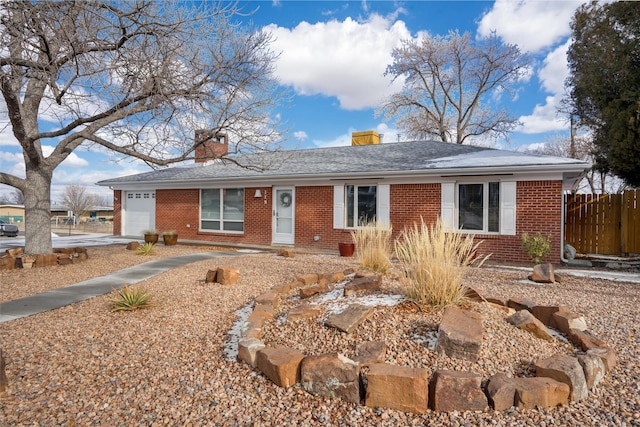 single story home featuring a garage