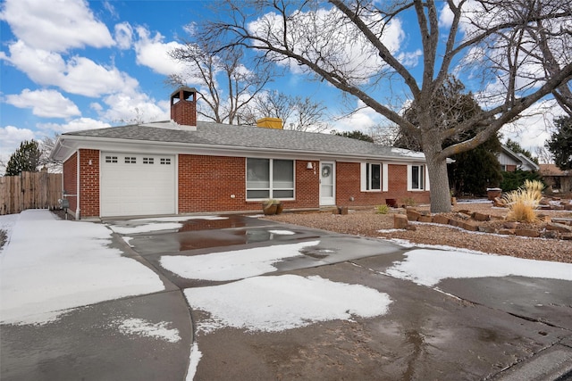 ranch-style house featuring a garage