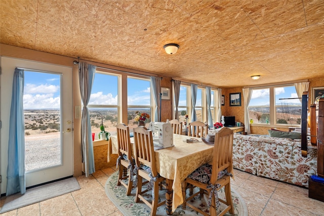 tiled dining area with wooden ceiling