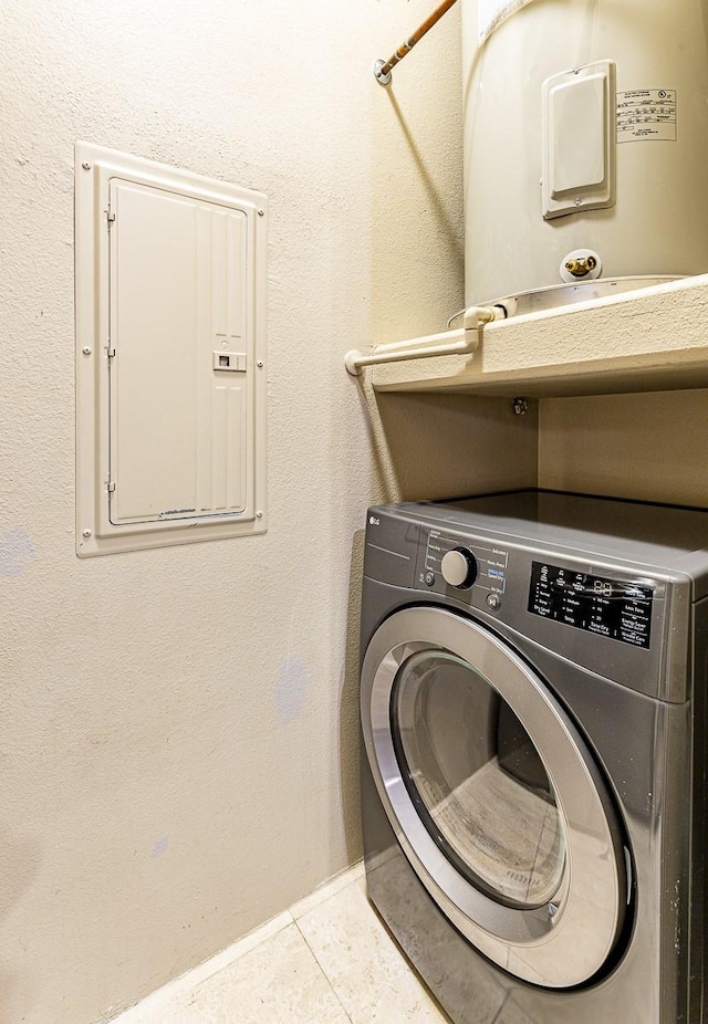 clothes washing area featuring washer / dryer, electric water heater, electric panel, and light tile patterned floors