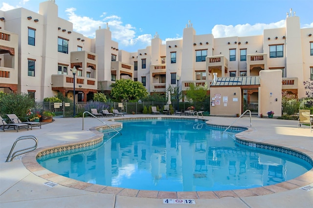 view of swimming pool with a patio