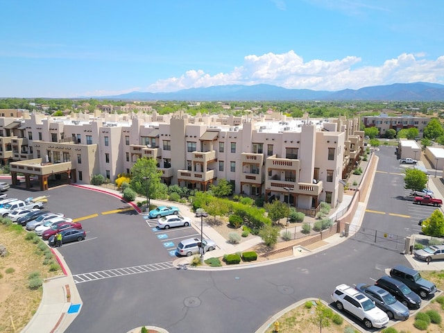 birds eye view of property featuring a mountain view