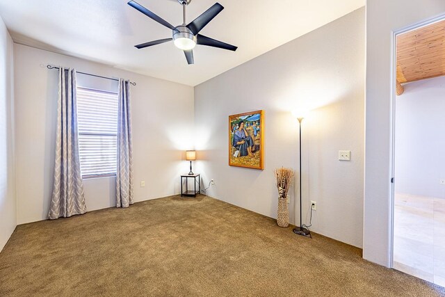 unfurnished bedroom with carpet floors, ensuite bathroom, and ceiling fan