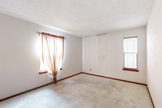 empty room with a textured ceiling