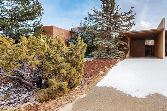 exterior space with a carport