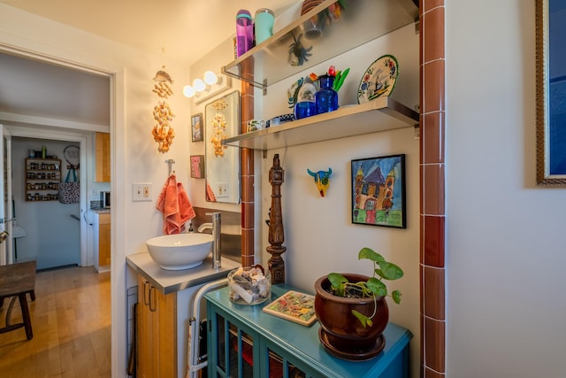 interior space with sink and hardwood / wood-style floors