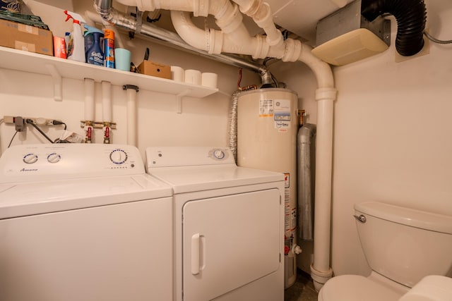 washroom with washer and dryer and gas water heater