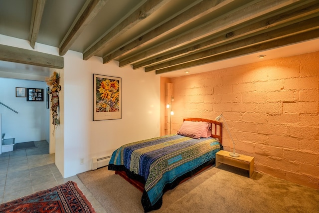 bedroom featuring beam ceiling and a baseboard heating unit