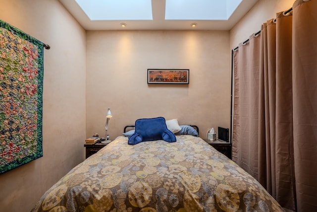 bedroom featuring a skylight