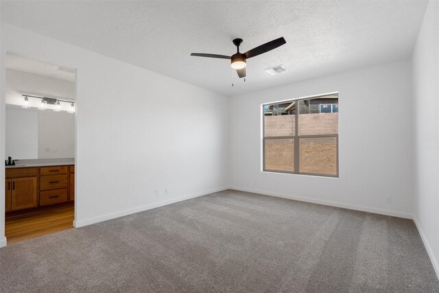 full bathroom featuring tile patterned flooring, tiled shower / bath combo, vanity, and toilet