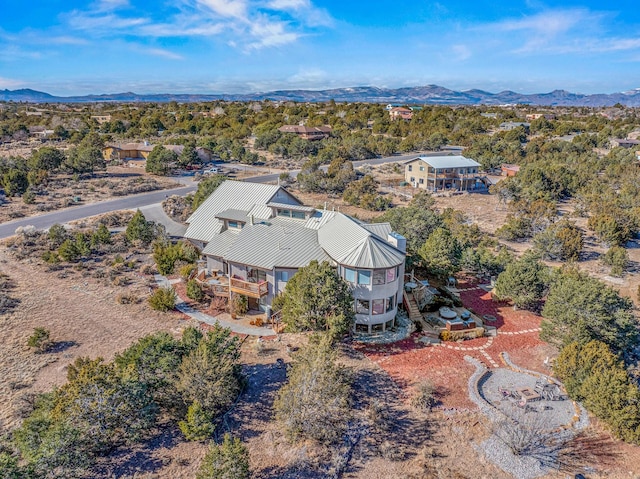 birds eye view of property with a mountain view