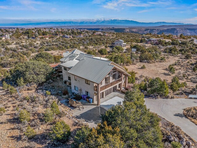 drone / aerial view featuring a mountain view