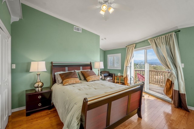 bedroom featuring ceiling fan, ornamental molding, hardwood / wood-style flooring, and access to exterior