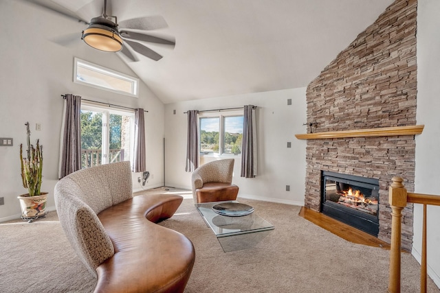 living room featuring a fireplace, high vaulted ceiling, ceiling fan, and carpet