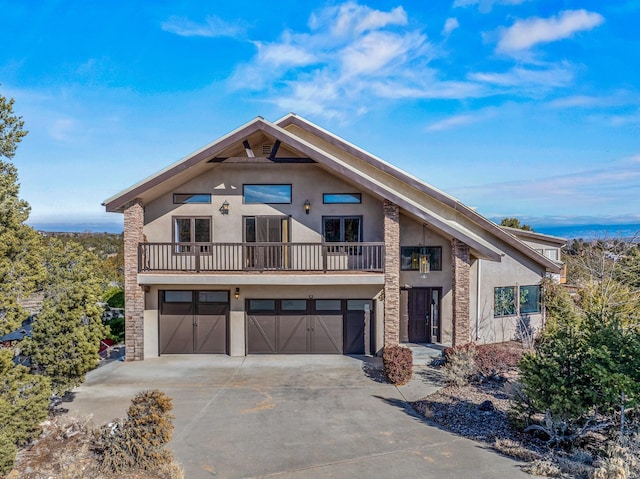 view of front of home featuring a balcony and a garage