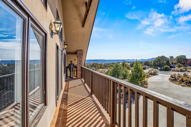 balcony with a water and mountain view