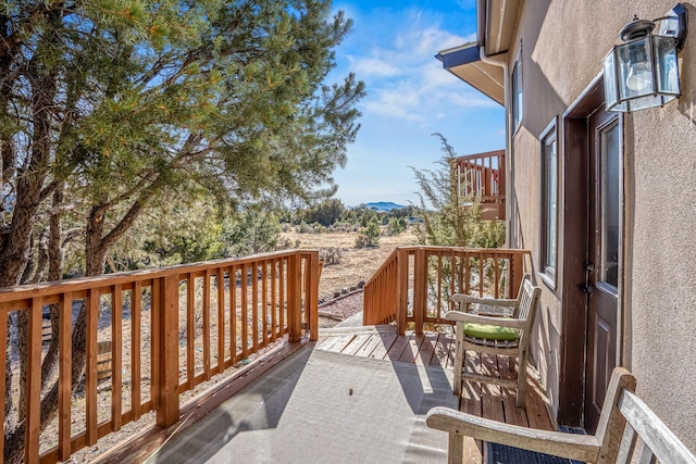 balcony featuring a deck with mountain view