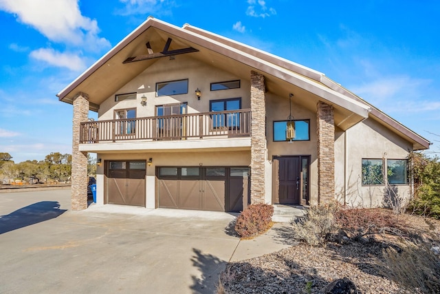 view of front facade featuring a balcony and a garage