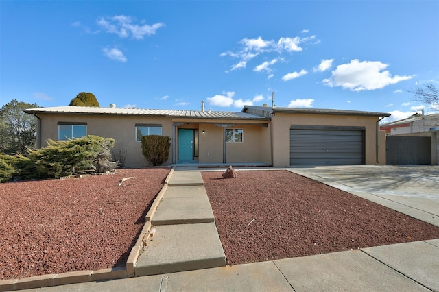 ranch-style home with a garage