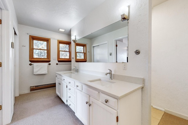 bathroom with a baseboard radiator and vanity