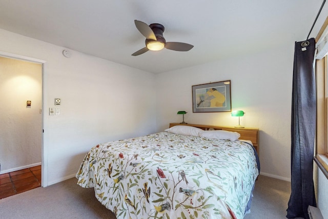 bedroom featuring ceiling fan, a baseboard radiator, and carpet flooring