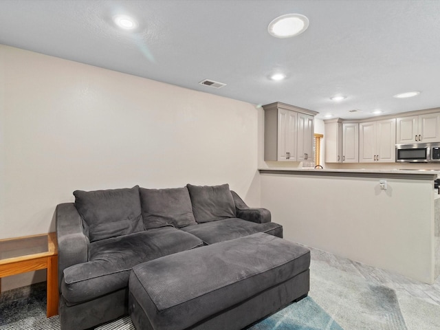 living room with light colored carpet