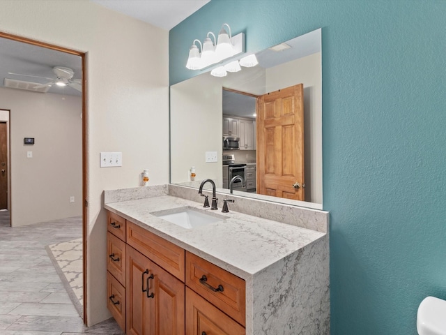 bathroom with vanity and ceiling fan