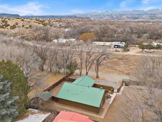 birds eye view of property with a mountain view