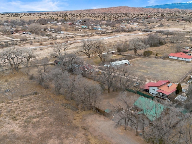 birds eye view of property featuring a mountain view