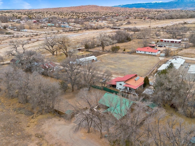 birds eye view of property featuring a mountain view