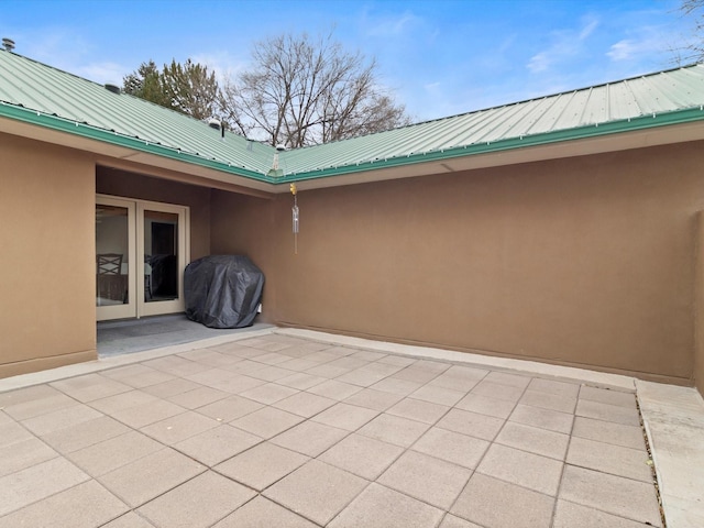 view of patio featuring a grill