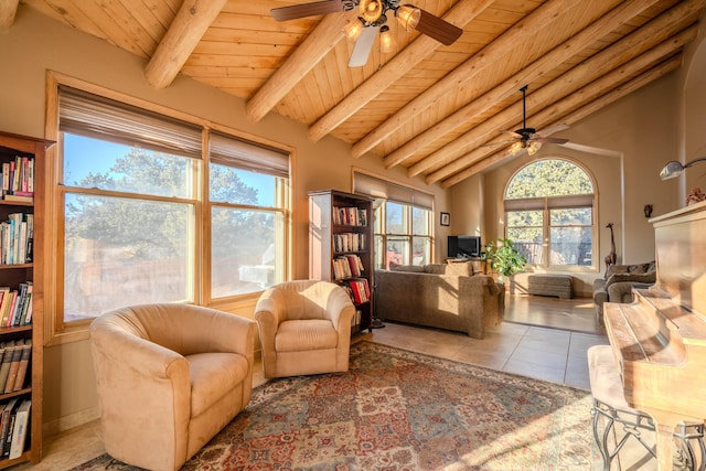 tiled living room featuring lofted ceiling with beams, ceiling fan, and wood ceiling