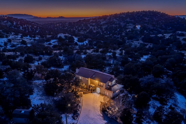 aerial view at dusk with a mountain view