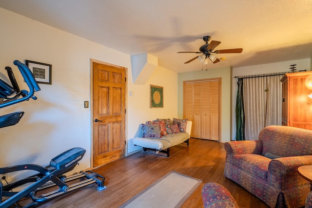 living room featuring ceiling fan, a textured ceiling, light hardwood / wood-style floors, and french doors