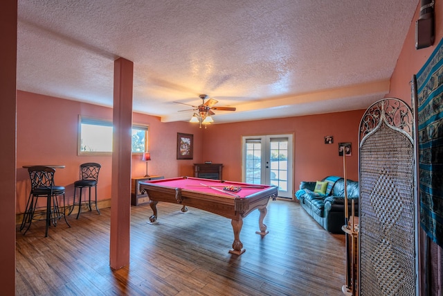 rec room with pool table, french doors, wood finished floors, and a ceiling fan