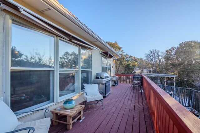 wooden deck featuring area for grilling