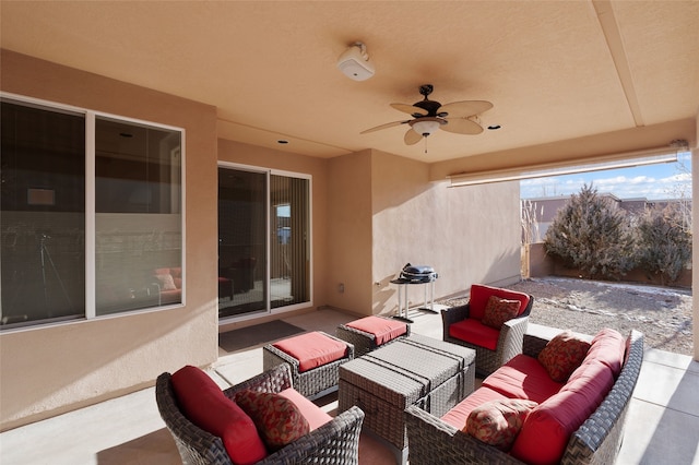 view of patio featuring ceiling fan and an outdoor living space