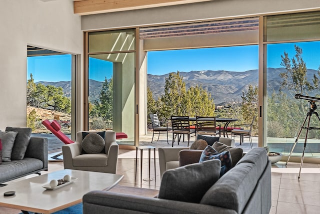 tiled living room with a mountain view and plenty of natural light