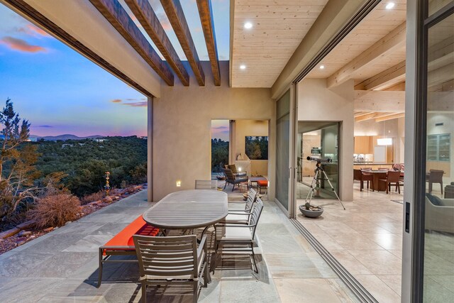 view of patio terrace at dusk