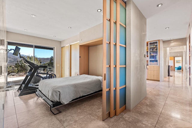 tiled bedroom featuring access to outside