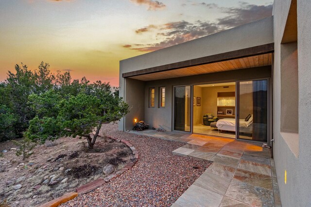 bedroom with access to outside, multiple windows, and a mountain view