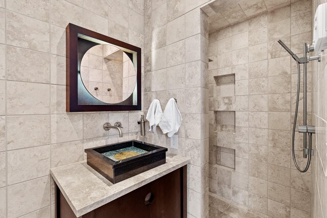 hall with sink and light tile patterned floors