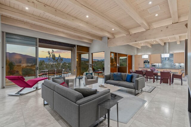 tiled living room featuring a wealth of natural light, beam ceiling, and wooden ceiling