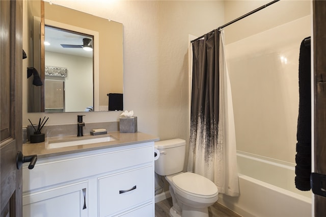 full bathroom with shower / bathtub combination with curtain, wood-type flooring, vanity, and toilet