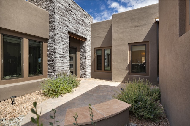 doorway to property featuring a patio area