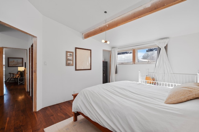 bedroom featuring dark wood-type flooring and lofted ceiling with beams