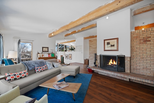 living room featuring dark hardwood / wood-style flooring, a fireplace, and beam ceiling