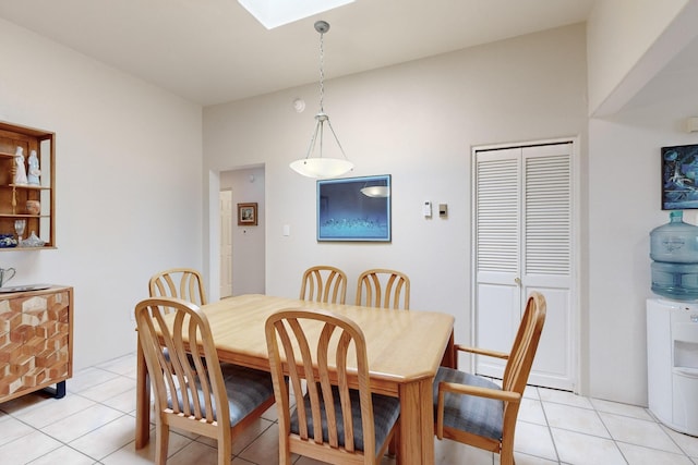 dining space featuring light tile patterned floors